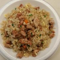 Chicken Fried Rice · Wok fried rice with green peas and onions, seasoning in a light soy sauce.