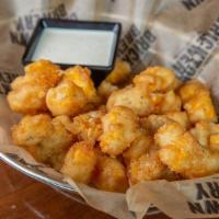 Watonga Cheddar Curds · Beer-battered Watonga cheddar curds. Served with ranch dressing.