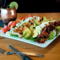 Cobb Salad · Grilled chicken, avocado, egg, bleu cheese crumbles, tomatoes, sweet peppered bacon. Tossed ...
