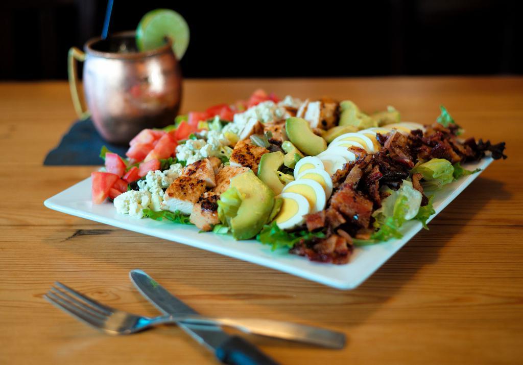 Cobb Salad · Grilled chicken, avocado, egg, bleu cheese crumbles, tomato, sweet peppered bacon. Tossed in brown derby vinaigrette.