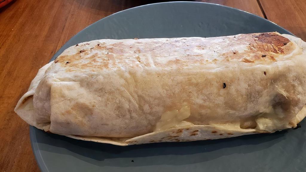 Mega Burrito · Rice, pinto beans, crema, pico de gallo, salsa verde, cheese and jalapenos with your choice of pulled pork, pulled chicken, ground beef, or veggie fajita