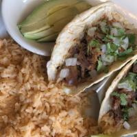 Carnitas Tacos (2) · Corn tortillas filled with pork carnitas topped with cilantro and onion. Served with a side ...