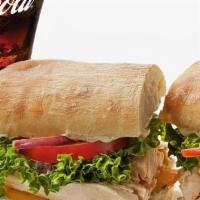 Chicken On Ciabatta Combo · Pulled off the bone sweet garlic rotisserie chicken on a Ciabatta roll dressed with herbed m...
