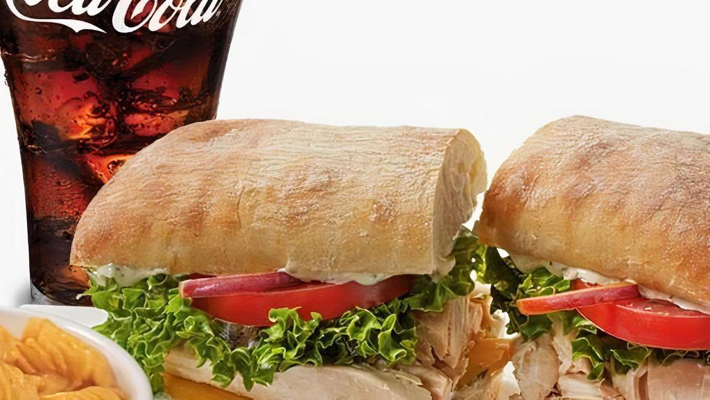 Chicken On Ciabatta Combo · Pulled off the bone sweet garlic rotisserie chicken on a Ciabatta roll dressed with herbed mayo, lettuce, tomato and cheddar cheese. Served with 1 side and a drink.