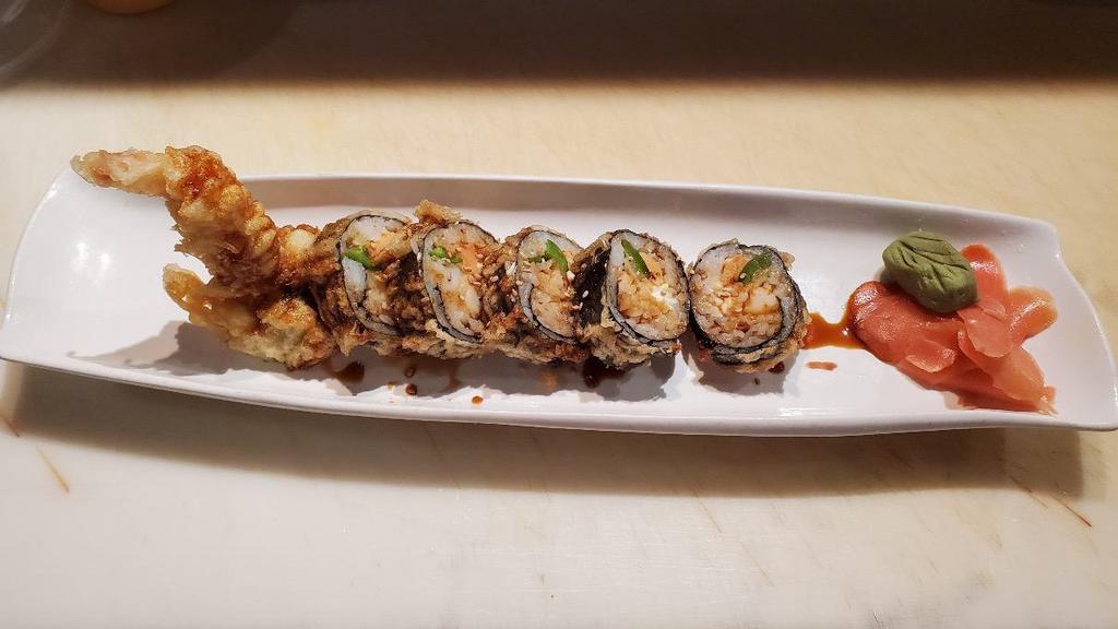 Jalapeño Roll · Jalapeno, cream cheese, smoked salmon, shrimp tempura, rolled with seaweed, lightly fried topped with eel sauce.