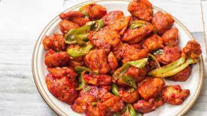 Chicken 65 · Boneless Chicken Cubes marinated &tossed in spiced yogurt
sauce flavored with Curry Leaves.