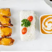 Chicken Tikka Masala · Chicken breast cooked in clay oven and blended in tomatoes, cream and house spices.