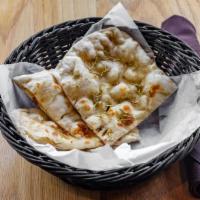 Rosemary Naan · Unleavened white bread baked with dried rosemary leaves