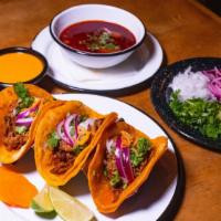 Birria Tacos · corn or flour tortilla stuffed with our delicious birria meat topped with cilantro and onion...