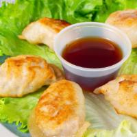 Pan-Fried Potstickers (5) · Crescent-shaped pork dumplings pan-fried to a golden brown. Served with a ginger soy dipping...