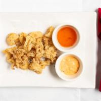 Thai-Style Calamari · Succulent calamari, battered fried to golden brown. Served with spicy mayo and lemongrass fi...