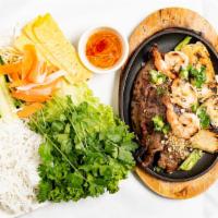 Triple Delight · A generous combination of Vietnamese Grilled Beef Fajitas, Vietnamese Grilled Chicken Fajita...