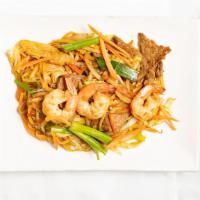Kim Son Deluxe Lo Mein · Lo mein noodles stir-fried with beef, chicken, shrimp, cabbage, carrots & onions in lo mein ...