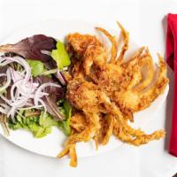 Garlic Butter Soft-Shell Crabs · Lightly battered & golden-fried soft-shell crabs over mixed greens & topped with delicious g...