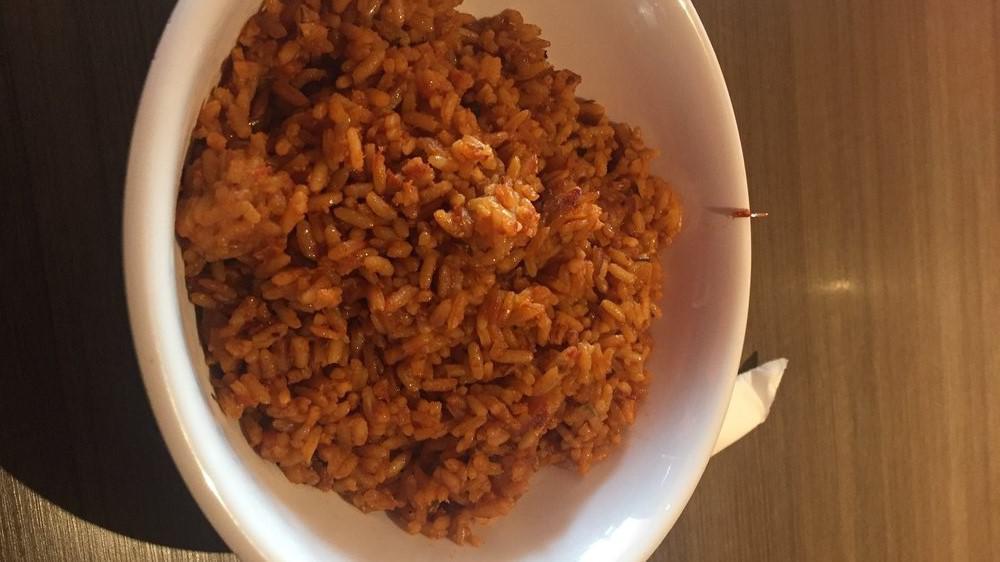Jollof Rice · Special. Organic. Hot. A West African mainstay, also called Benachin is a flavorful tasty rice, simmered in spicy savory deep fried tomato stew.