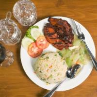Grilled Chicken Rice Platter · Grilled chicken breast served with rice, salad, pita bread, and tzatziki.