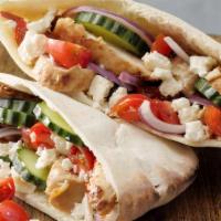 Grilled Chicken Pita · Grilled chicken breast wrapped in a pita with lettuce, tomato, onion, and tzatziki.