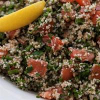 Tabouleh Salad · Bulger wheat, tomato, parlsey, lemon juice, and olive oil.