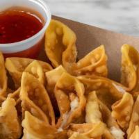 Crab & Cheese Rangoon* · Served with sweet and sour dipping sauce.