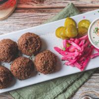 Falafel ( 6Pcs) · Falafel is a deep-fried ball or patty-shaped fritter made from ground chickpeas and parsley....