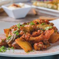 Okra Mousaka · Okra mixed with onion both stewed in a Greek style aromatic tomato sauce until they perfectl...