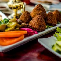 Falafel Plate · Four large pieces of falafel protein. Served with rice, hummus, feta salad, side of tahini, ...