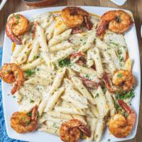 Shrimp Pasta · Penne pasta with our homemade alferdo sauce mixed with little of dry sun tomato topped with ...