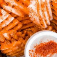 Indomitable Fries · Criss cut waffle fries tossed in our dry curry rub served with Yuzu Aioli