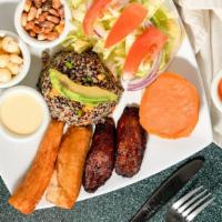 Vegetarian Platter · Quinoa salad with carrots, peas and avocado, plantains, fried yucca, Peruvian white corn, sw...