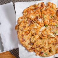 Seafood Pancake · Shrimp, squid, clams, onions, green onions and carrots.