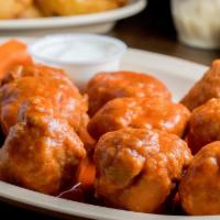 Boneless Wings (6) · Fried in pure canola oil. Includes celery, carrots, and a choice of blue cheese or ranch dre...
