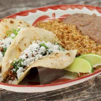 Barbacoa Tacos · 2 Slow braised beef brisket tacos on our homemade corn tortillas with cilantro, onions and q...
