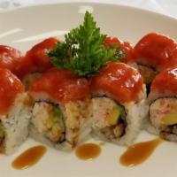 Fire Dragon · Raw. Spicy. Eel, crabmeat, cucumber, avocado, cream cheese topped with spicy tuna, eel sauce.