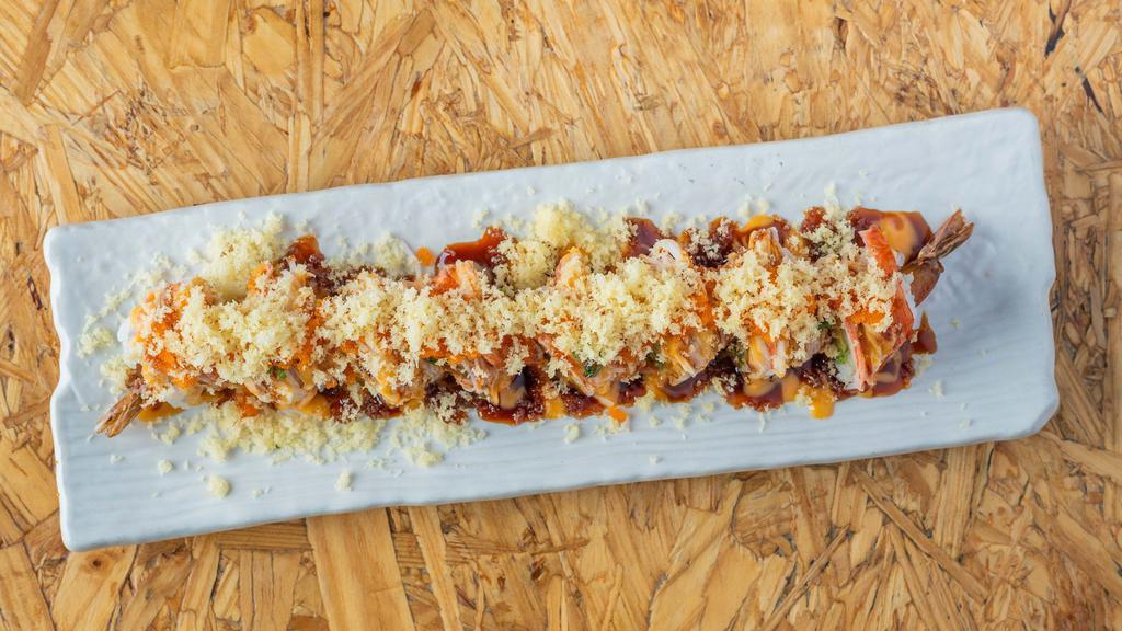King Shaggy Roll · Shrimp tempura, avocado, cream cheese topped with crab stick, caviar, crunchy flakes, spicy mayo & sweet soy