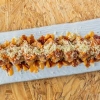 Hot Mama Roll · *Spicy* Tempura fried (smoked salmon, cream cheese, and avocado) and topped with spicy tuna,...