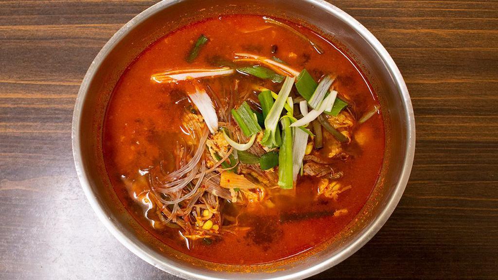 Yukgae Jang · Spicy beef soup with sliced beef, vegetables, and clear noodles.