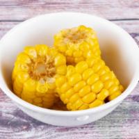 Corn · Sweet corn on the cob pieces.