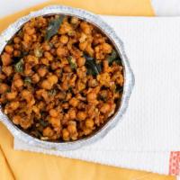Chana Masala · Chick peas cookes with special creamy sauce flavored with turmeric & cumin.