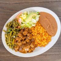 Carne Guisada Plate · Famously known for our beef tips in gravy served with nopalitos, rice, beans, salad, and tor...