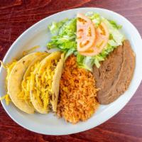 Crispy Tacos Plate · Three crispy tacos, served with rice, beans, and salad.