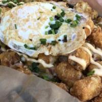 Loaded Tots · Piled high with bacon, onions, cheese, jalapeños, herbs, chipotle mayo and finished off with...