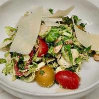 Kale And Brussels · Shaved brussels sprouts and kale, marcona almonds, heirloom tomatoes, and parmesan reggiano....