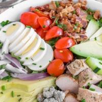 Chicken Cobb Salad · Romine lettuce, spring Mix, grape tomatoes, cucumber, bacon bits, fresh avocado, chives, Ble...