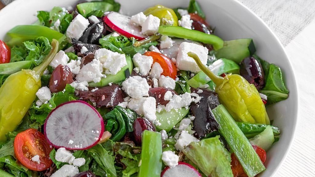 Greek Salad · This classic salad features fresh Romaine lettuce along with other mixed greens and grape tomatoes, cucumbers, bell peppers, radishes, Feta cheese, Kalamata olives and our house Greek dressing(the dressing does contain dairy).