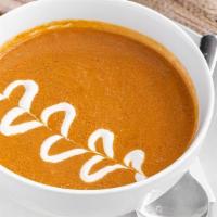 Tomato Basil Soup · Our Tomato Basil Soup is made with roasted tomatoes, bell peppers, garlic and onion blended ...