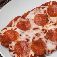 Pizza Schnitzel · Chicken or Pork Schnitzel topped with Homemade Marinara sauce, pepperoni and Mozzarella chee...