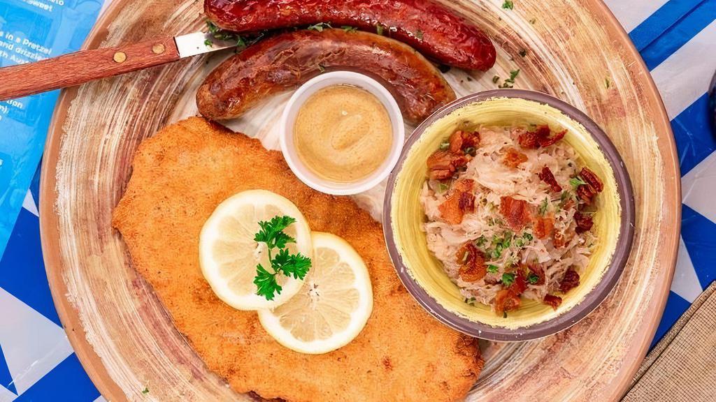 Sausage And Schnitzel Plate · Includes two Traditional sausages and the guest’s choice of chicken or pork wiener schnitzel, as well as two standard sides.