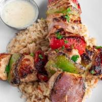 Drunken Chicken · This dish consists of two grilled chicken skewers with bell peppers and onions. The chicken ...