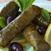 Dolmas · Home made and rolled vegetarian grape leaves stuffed in rice and veggies.