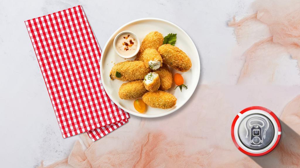 Jalapeno Poppers · (Vegetarian) Six pieces of fresh jalapenos coated in cream cheese and fried until golden brown.